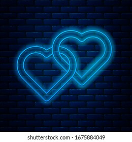 Glowing neon line Two Linked Hearts icon isolated on brick wall background. Romantic symbol linked, join, passion and wedding. Happy Women Day.  Vector Illustration