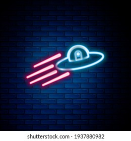 Glowing neon line UFO flying spaceship and alien icon isolated on brick wall background. Flying saucer. Alien space ship. Futuristic unknown flying object. Colorful outline concept. Vector