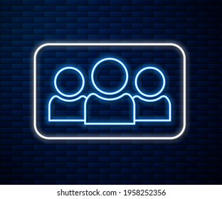 Glowing neon line Users group icon isolated on brick wall background. Group of people icon. Business avatar symbol - users profile icon.  Vector