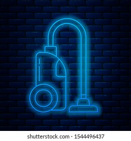 Glowing neon line Vacuum cleaner icon isolated on brick wall background.  Vector Illustration