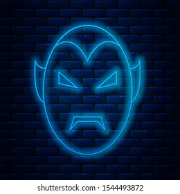 Glowing neon line Vampire icon isolated on brick wall background. Happy Halloween party.  Vector Illustration