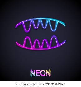 Glowing neon line Vampire teeth icon isolated on black background. Happy Halloween party.  Vector