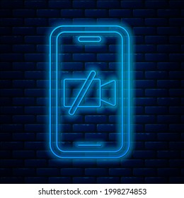 Glowing neon line Video camera Off on mobile screen icon isolated on brick wall background. No video.  Vector