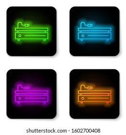 Glowing neon line Video game console icon isolated on white background. Black square button. Vector Illustration