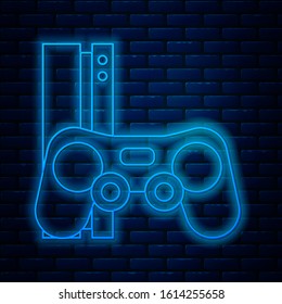 Glowing neon line Video game console with joystick icon isolated on brick wall background.  Vector Illustration