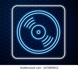Glowing neon line Vinyl disk icon isolated on brick wall background.  Vector Illustration