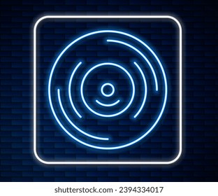 Glühendes Neonline-Vinyl-Scheibensymbol einzeln auf Ziegelmauern-Hintergrund.  Vektorgrafik