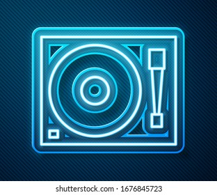 Glowing neon line Vinyl player with a vinyl disk icon isolated on blue background.  Vector Illustration