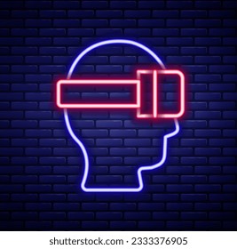 Glowing neon line Virtual reality glasses icon isolated on brick wall background. Stereoscopic 3d vr mask. Optical head mounted display. Colorful outline concept. Vector