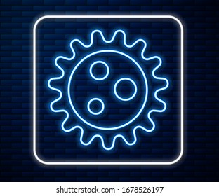 Glowing neon line Virus icon isolated on brick wall background. Corona virus 2019-nCoV. Bacteria and germs, cell cancer, microbe, fungi.  Vector Illustration