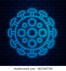 Glowing neon line Virus icon isolated on brick wall background. Corona virus 2019-nCoV. Bacteria and germs, cell cancer, microbe, fungi.  Vector Illustration