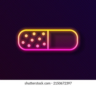 Glowing neon line Vitamin complex of pill capsule icon isolated on black background. Healthy lifestyle.  Vector