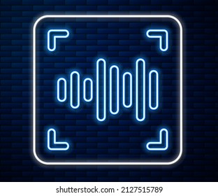 Glowing neon line Voice recognition icon isolated on brick wall background. Voice biometric access authentication for personal identity recognition. Cyber security.  Vector