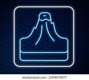 Glowing neon line Volcano icon isolated on brick wall background.  Vector