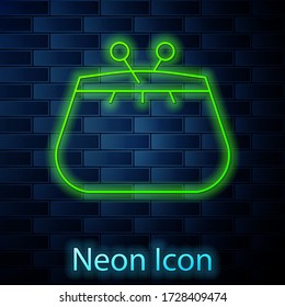 Glowing neon line Wallet icon isolated on brick wall background. Purse icon. Cash savings symbol. Vector Illustration