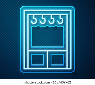 Glowing neon line Wardrobe icon isolated on blue background.  Vector Illustration