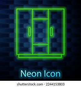 Glowing neon line Wardrobe icon isolated on brick wall background.  Vector