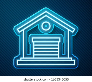 Glowing neon line Warehouse icon isolated on blue background.  Vector Illustration