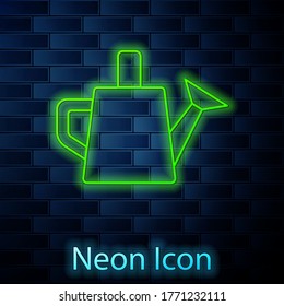 Glowing neon line Watering can icon isolated on brick wall background. Irrigation symbol. Vector
