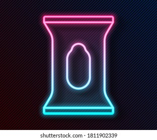 Glowing neon line Wet wipe pack icon isolated on black background.  Vector