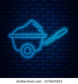 Glowing neon line Wheelbarrow with dirt icon isolated on brick wall background. Tool equipment. Agriculture cart wheel farm.  Vector Illustration