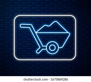 Glowing neon line Wheelbarrow with dirt icon isolated on brick wall background. Tool equipment. Agriculture cart wheel farm.  Vector Illustration