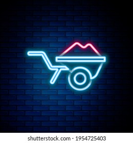 Glowing neon line Wheelbarrow with dirt icon isolated on brick wall background. Tool equipment. Agriculture cart wheel farm. Colorful outline concept. Vector