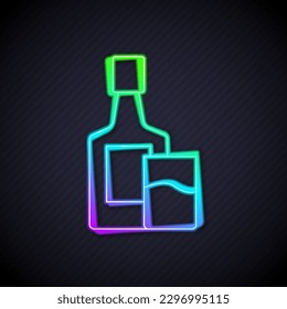 Glowing neon line Whiskey bottle and glass icon isolated on black background.  Vector