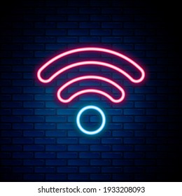 Glowing neon line Wi-Fi wireless internet network symbol icon isolated on brick wall background. Colorful outline concept. Vector