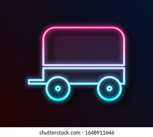 Glowing neon line Wild west covered wagon icon isolated on black background.  Vector Illustration