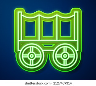 Glowing Neon Line Wild West Covered Wagon Icon Isolated On Blue Background.  Vector