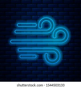 Glowing neon line Wind icon isolated on brick wall background. Windy weather.  Vector Illustration