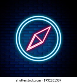 Glowing neon line Wind rose icon isolated on brick wall background. Compass icon for travel. Navigation design. Colorful outline concept. Vector