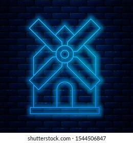 Glowing neon line Windmill icon isolated on brick wall background.  Vector Illustration