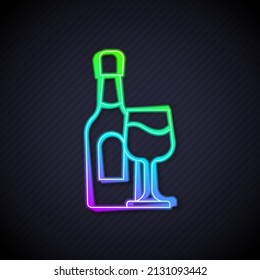 Glowing neon line Wine bottle with glass icon isolated on black background.  Vector