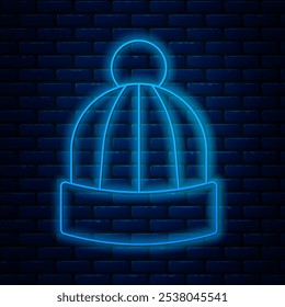 Glowing neon line Winter hat icon isolated on brick wall background.  Vector