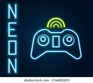 Glowing neon line Wireless gamepad icon isolated on black background. Game controller. Colorful outline concept. Vector Illustration