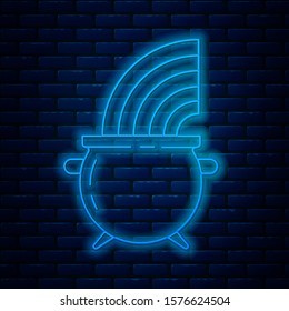 Glowing neon line Witch cauldron and rainbow icon isolated on brick wall background. Happy Saint Patricks day.  Vector Illustration