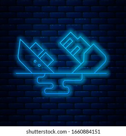 Glowing neon line Wrecked oil tanker ship icon isolated on brick wall background. Oil spill accident. Crash tanker. Pollution Environment concept.  Vector Illustration