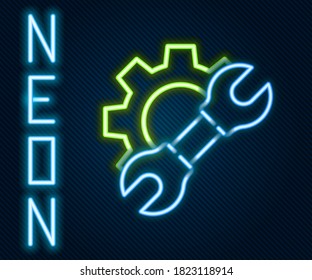 Glowing neon line Wrench spanner and gear icon isolated on black background. Adjusting, service, setting, maintenance, repair, fixing. Colorful outline concept. Vector Illustration