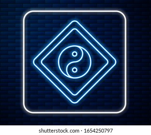Glowing neon line Yin Yang symbol of harmony and balance icon isolated on brick wall background.  Vector Illustration