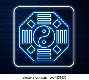 Glowing neon line Yin Yang symbol of harmony and balance icon isolated on brick wall background.  Vector Illustration