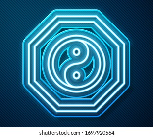Glowing neon line Yin Yang symbol of harmony and balance icon isolated on blue background.  Vector Illustration