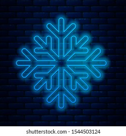 Glowing neon lineSnowflake icon isolated on brick wall background.  Vector Illustration