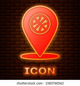 Glowing neon Location with basketball ball inside icon isolated on brick wall background.  Vector Illustration