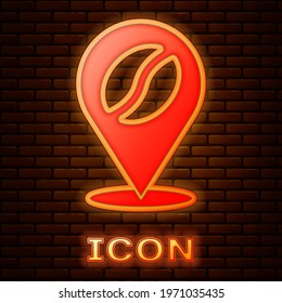 Glowing neon Location with coffee bean icon isolated on brick wall background.  Vector