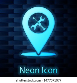 Glowing neon Location with crossed screwdriver and wrench tools icon isolated on brick wall background. Pointer settings symbol.  Vector Illustration