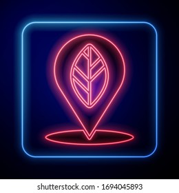 Glowing neon Location pin with leaf inside icon isolated on blue background.  Vector Illustration