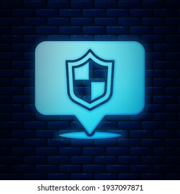 Glowing neon Location shield icon isolated on brick wall background. Insurance concept. Guard sign. Security, safety, protection, privacy concept.  Vector