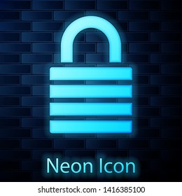 Glowing neon Lock icon isolated on brick wall background. Padlock sign. Security, safety, protection, privacy concept. Vector Illustration
